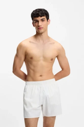 Swim shorts with all-over stacked logos