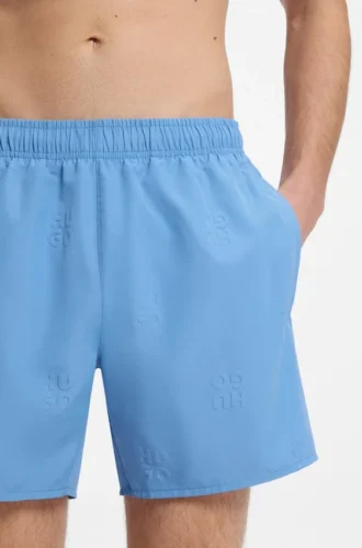Swim shorts with all-over stacked logos