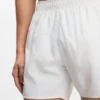 Swim shorts with all-over stacked logos