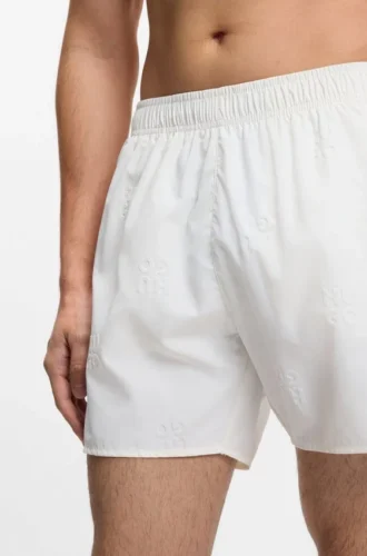 Swim shorts with all-over stacked logos