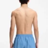 Swim shorts with all-over stacked logos