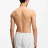 Swim shorts with all-over stacked logos