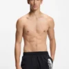 Swim shorts with metallic split logo