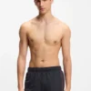 Swim shorts with repeated logos