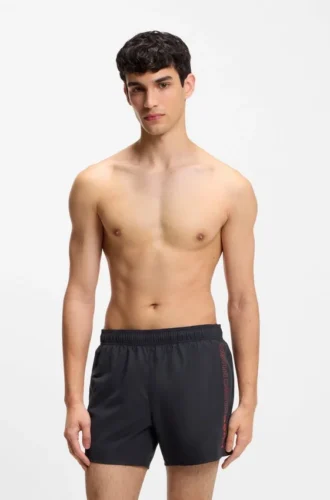 Swim shorts with repeated logos