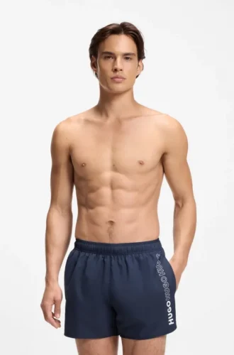 Swim shorts with repeated logos