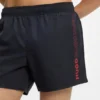 Swim shorts with repeated logos