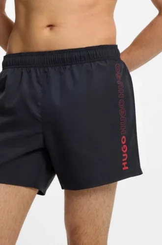 Swim shorts with repeated logos