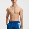 Swim shorts with vertical logo print