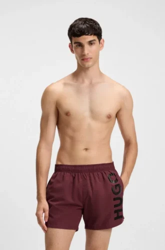 Swim shorts with vertical logo print