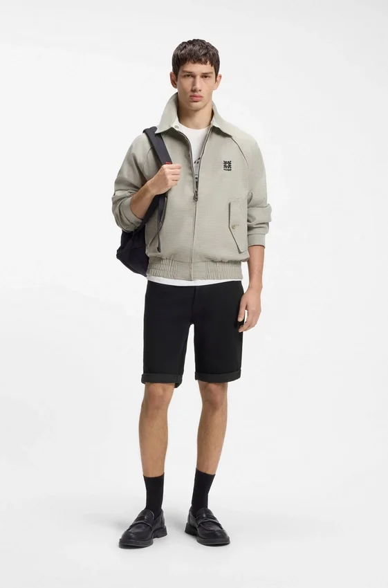 Tapered-fit shorts in black stretch denim Tapered-fit shorts in black stretch denim