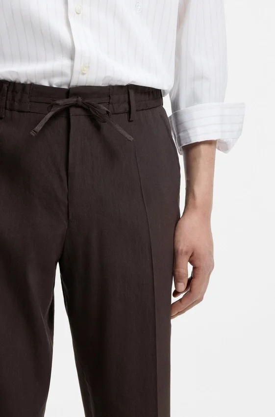 Tapered-fit trousers in a linen blend Tapered-fit trousers in a linen blend