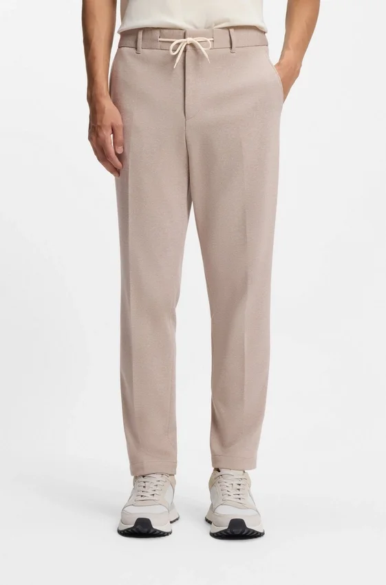 Tapered-fit trousers with reversible drawstring Tapered-fit trousers with reversible drawstring