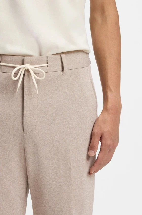 Tapered-fit trousers with reversible drawstring Tapered-fit trousers with reversible drawstring