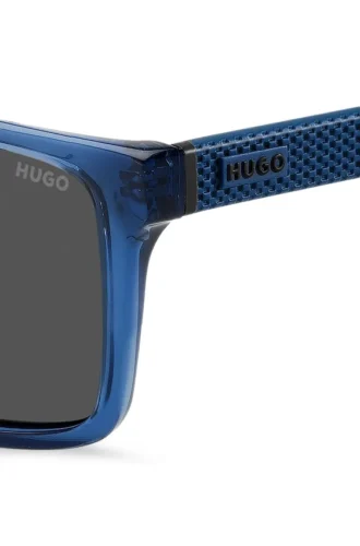 Transparent-blue sunglasses with patterned temples