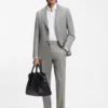 Two-piece slim-fit suit in cotton and virgin wool Two-piece slim-fit suit in cotton and virgin wool