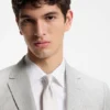 Two-piece slim-fit suit in cotton and virgin wool Two-piece slim-fit suit in cotton and virgin wool