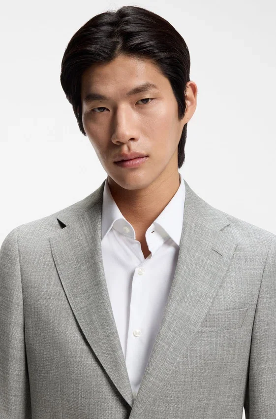 Two-piece slim-fit suit in cotton and virgin wool Two-piece slim-fit suit in cotton and virgin wool