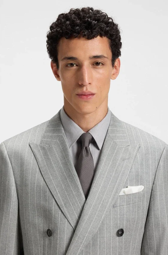 Two-piece slim-fit suit in striped virgin wool Two-piece slim-fit suit in striped virgin wool