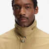 Water-repellent coat with concealed closure