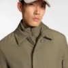 Water-repellent coat with detachable bib
