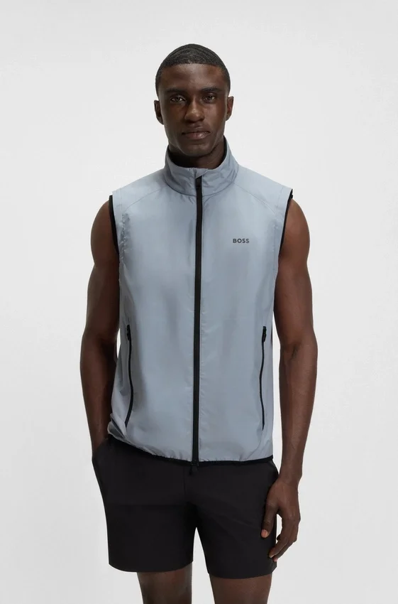 Water-repellent golf vest with decorative reflective details Water-repellent golf vest with decorative reflective details