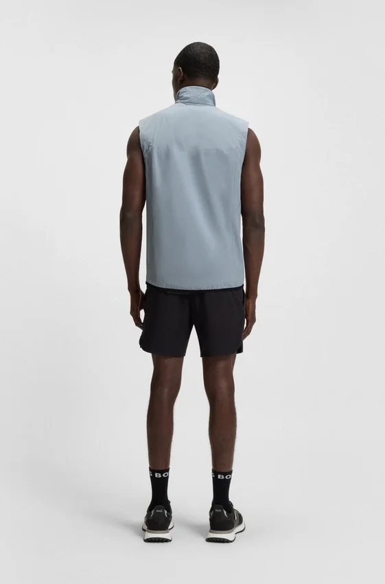 Water-repellent golf vest with decorative reflective details Water-repellent golf vest with decorative reflective details
