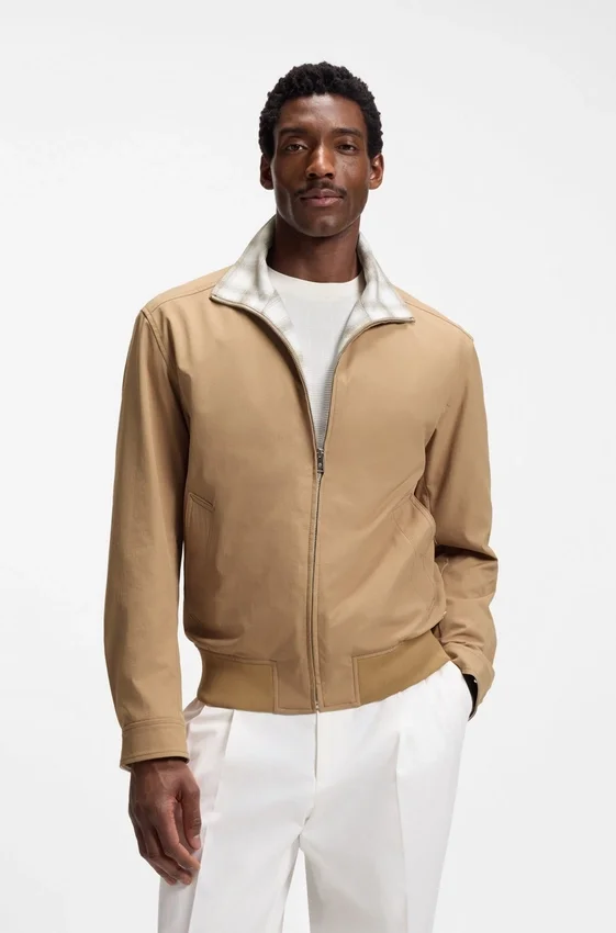 Water-repellent jacket with checkered collar Water-repellent jacket with checkered collar