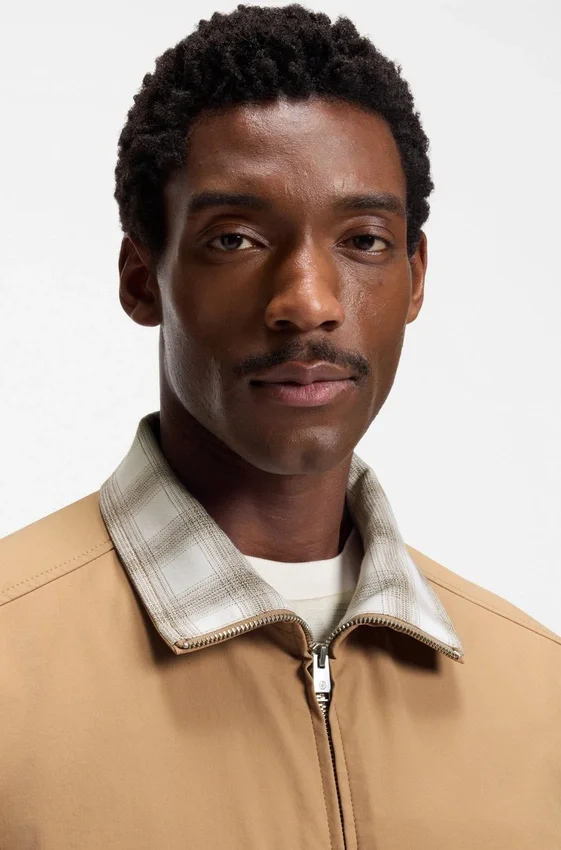 Water-repellent jacket with checkered collar Water-repellent jacket with checkered collar