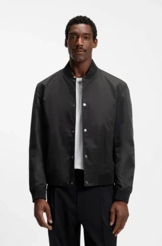 Water-repellent jacket with monogram-patterned sleeves