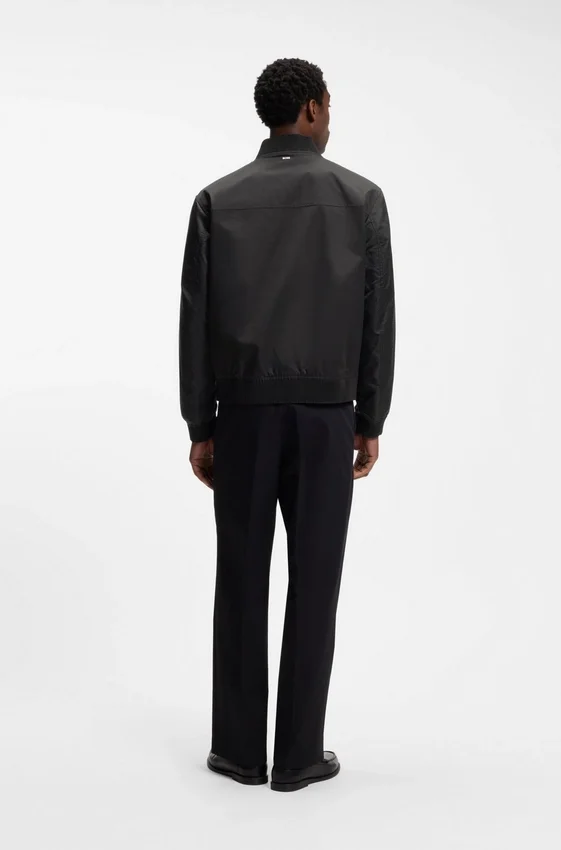 Water-repellent jacket with monogram-patterned sleeves Water-repellent jacket with monogram-patterned sleeves