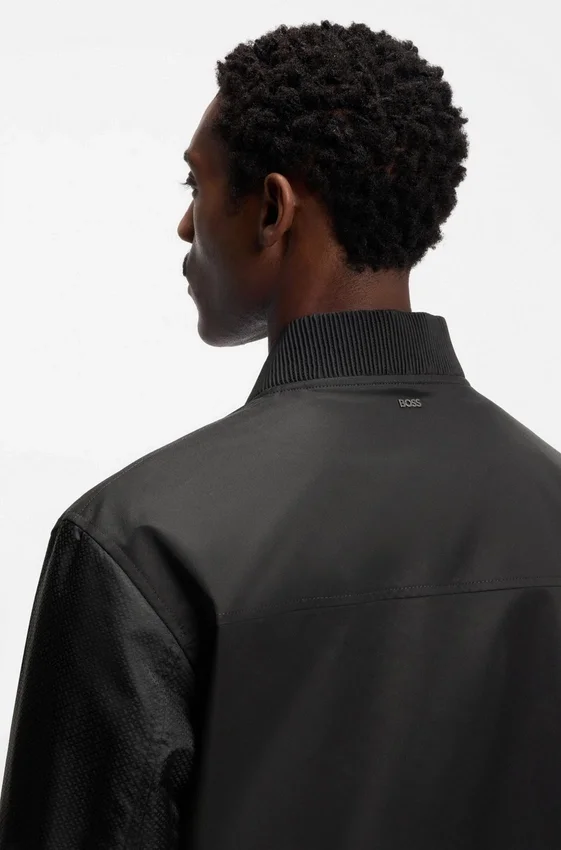 Water-repellent jacket with monogram-patterned sleeves Water-repellent jacket with monogram-patterned sleeves