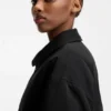 Water-repellent jacket with zipped sleeve pocket