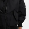 Water-repellent jacket with zipped sleeve pocket