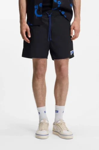 Water-repellent shorts with flag logo