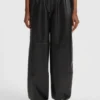 Wide-leg parachute trousers in faux leather