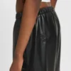 Wide-leg parachute trousers in faux leather